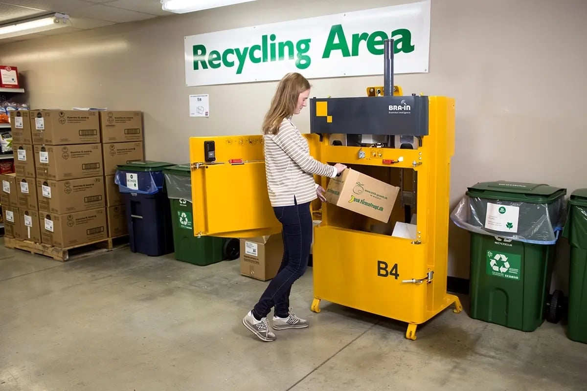 Before and after comparison showing 90% cardboard waste volume reduction with vertical baler machine